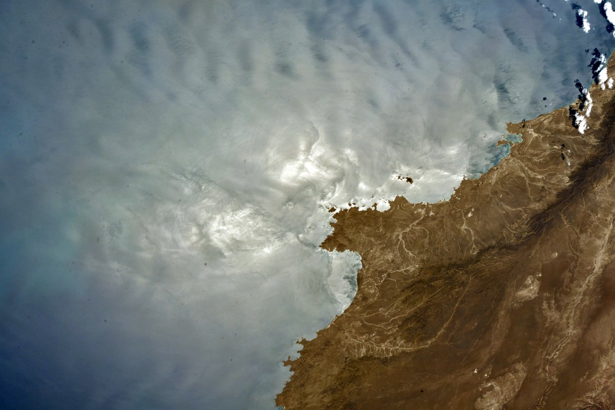 Sun glint often highlights the beauty of ocean waves, eddies, and currents. Off the Eastern Coast of Argentina.