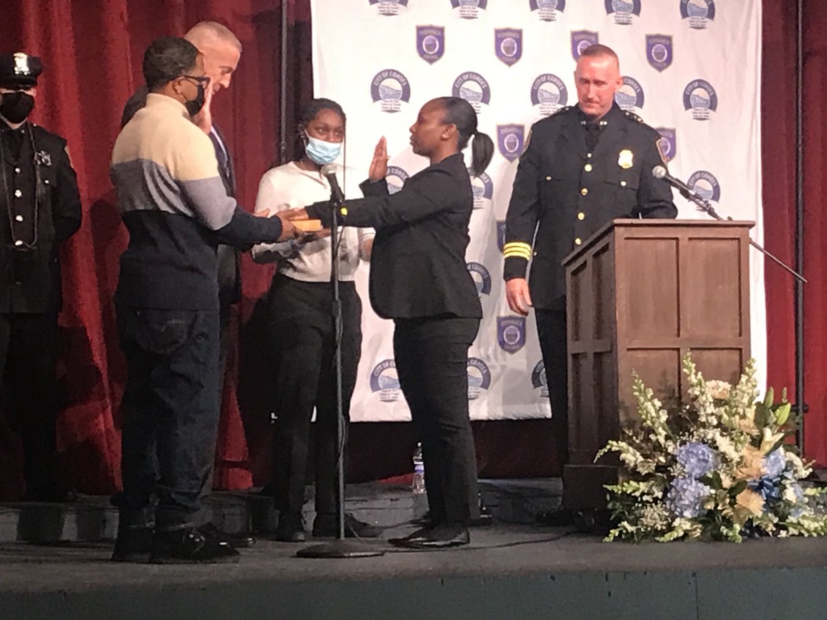 KennethCrowe's tweet photo. Cohoes Mayor Bill Keeler swears in Shamara Haggray, one of six new police officers and the city’s first Black officer, as family members and  Chief Todd Waldin observe Wednesday at Cohoes Music Hall. https://t.co/Poeci91Dsa