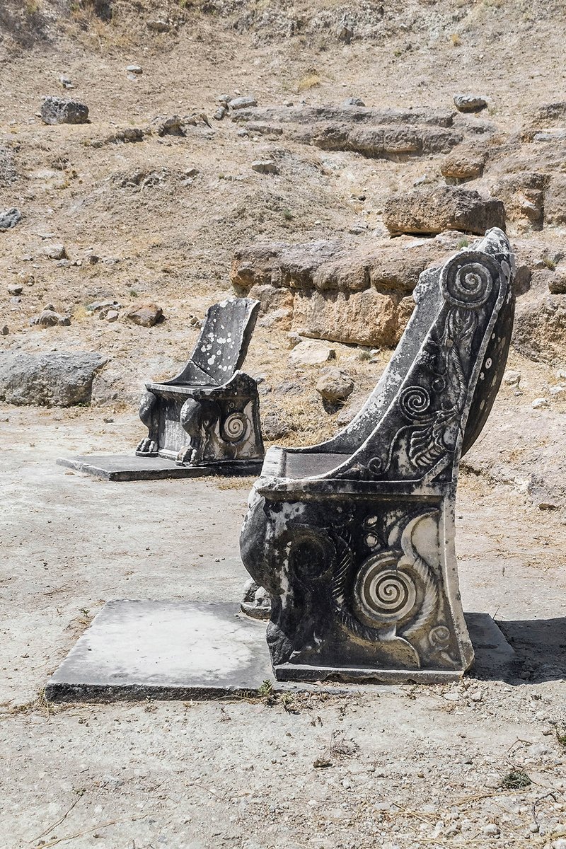Marble throne chairs at the ancient theater of Oropos (Amphiareion archaeological site), Attica, Greece.