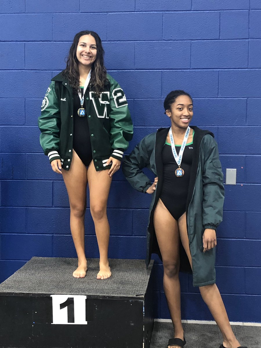 District Champion 100 butterfly Hannah Saenz and 3rd place fly Kayla Brown.
