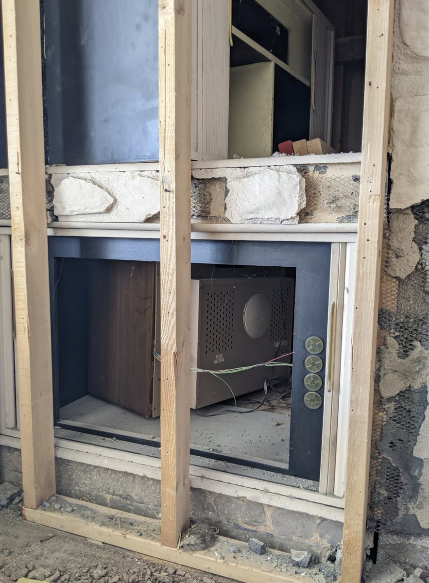 loft305's tweet photo. While demoing our fireplace facade we found another faux stone fireplace facade behind it - as well as a 60's era @MagnavoxCo TV! Previous contractor must have just pushed the cabinet &amp; TV back. Now we have space for a wet bar. 😂 #foundtreasure #remodeling https://t.co/X2EhKJJpN1