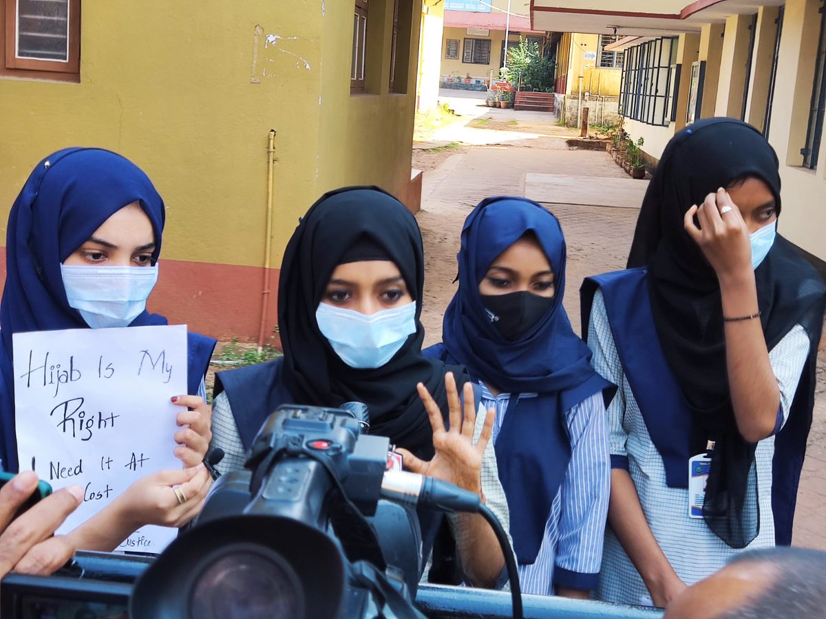 Samriddhi0809's tweet photo. *Victim students holds placards infront of College Gate* #HijabisOurRight
Students once again sent out of class, they now hold placards infront of college gate demanding Justice. They say authorities denied entry &amp; they are being marked absent. #UdupiStudentsNeedJustice https://t.co/Vj4Ok65g9r