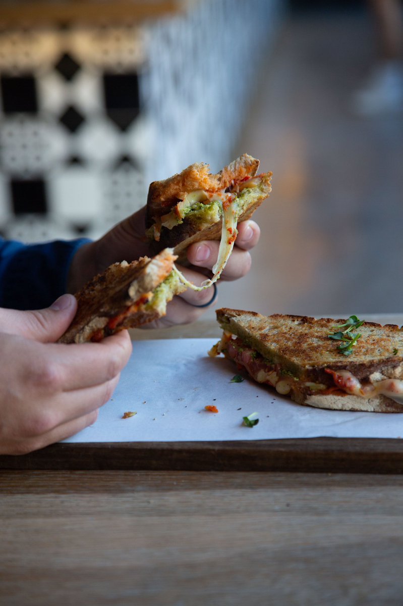 NEW! ⚡️ Caprese Sourdough Hot Press Roasted red pepper relish, sliced tomato, basil pesto, and melted emmental. #BootleggerCoffeeCompany