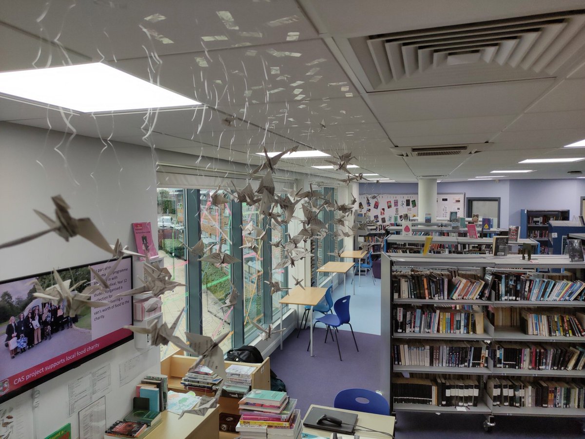 In my absence my student librarians have installed a flock of book birds. What a joyful wonder.