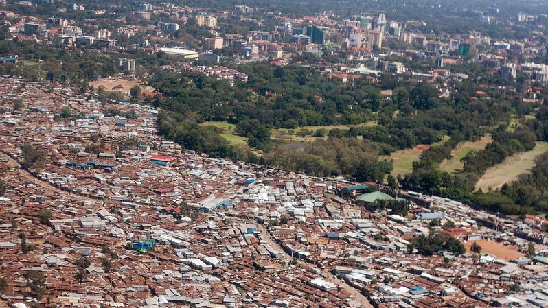 Rooftops in informal settlements next to a large green space in Nairobi.