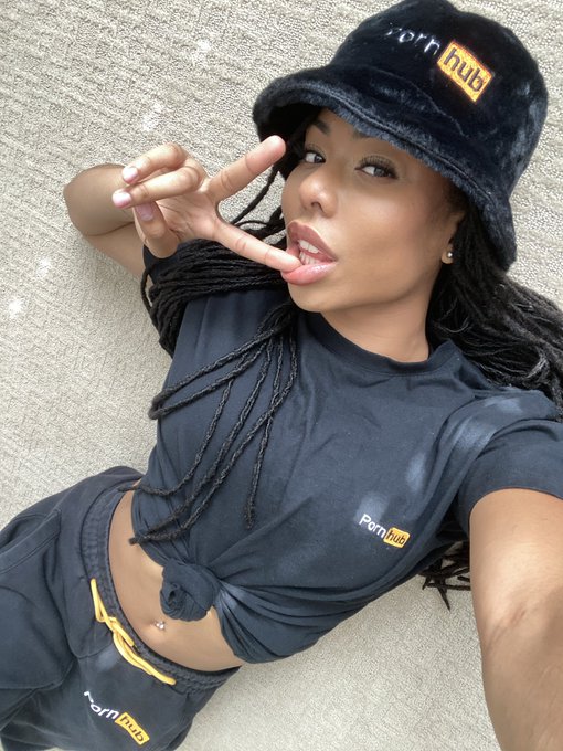 2 pic. This is what it looks like when you're trying to show off @Pornhub 's new bucket hat and slides