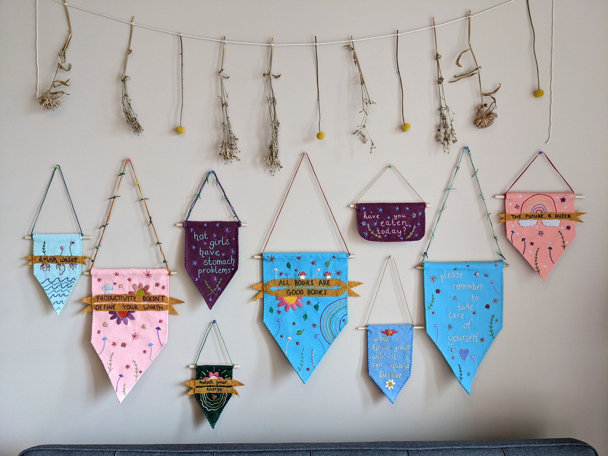 AmeliaEmbroider's tweet photo. Shop update happening TOMORROW on my Etsy at 7pm EST! All 9 of these entirely handmade, hand-embroidered felt banners will be available ❤️ #shopupdate #queerartist #embroidery #handmadewithlove https://t.co/tFXiuUrsh8