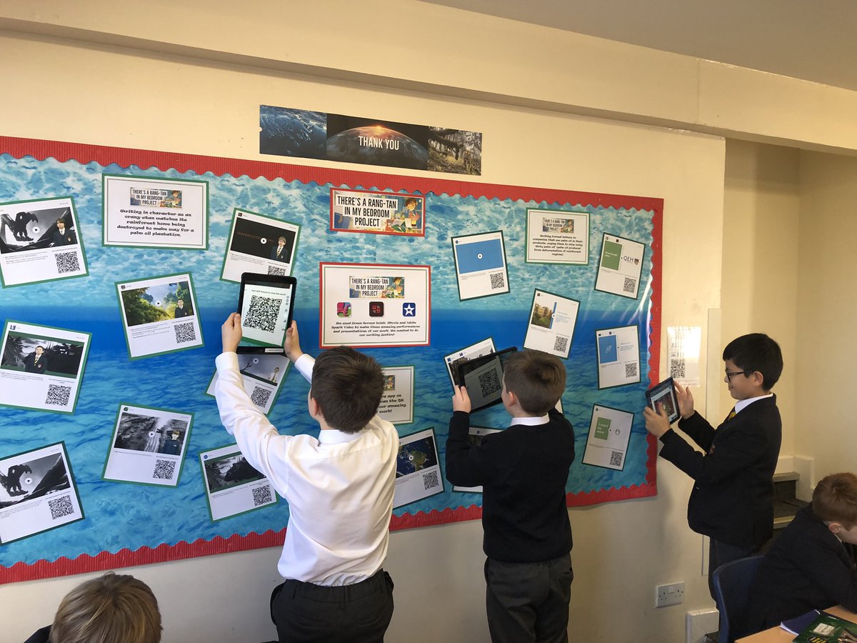 qehjuniors's tweet photo. Year 5 pupils enjoying an interactive display of performances of their writing. The boys scan QR codes to enjoy videos of their amazing work again on @Seesaw. @QEHSchool #qehcare #qehcharacter #qehcommunity #qehschool https://t.co/bcbeV6lfhd
