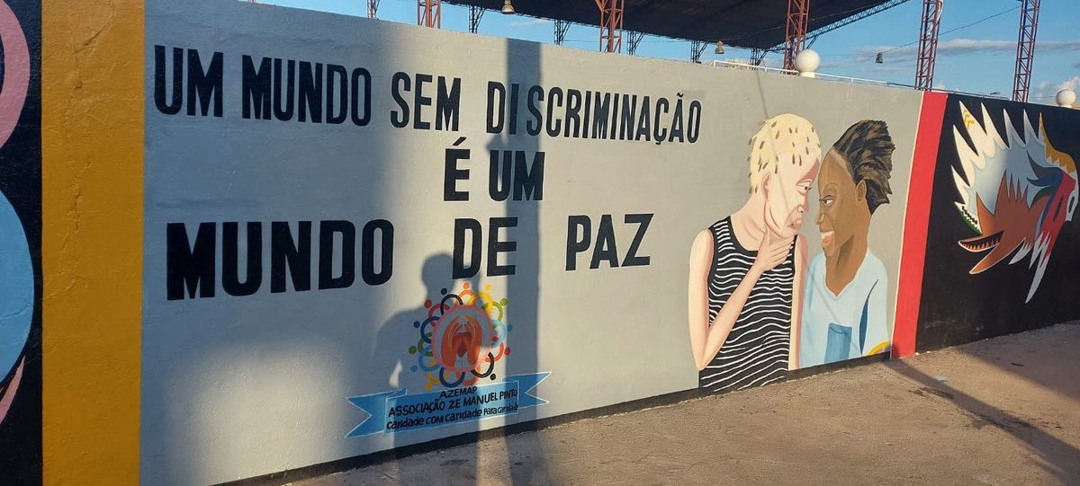 Mural that reads “a world without discrimination is a world of peace”.