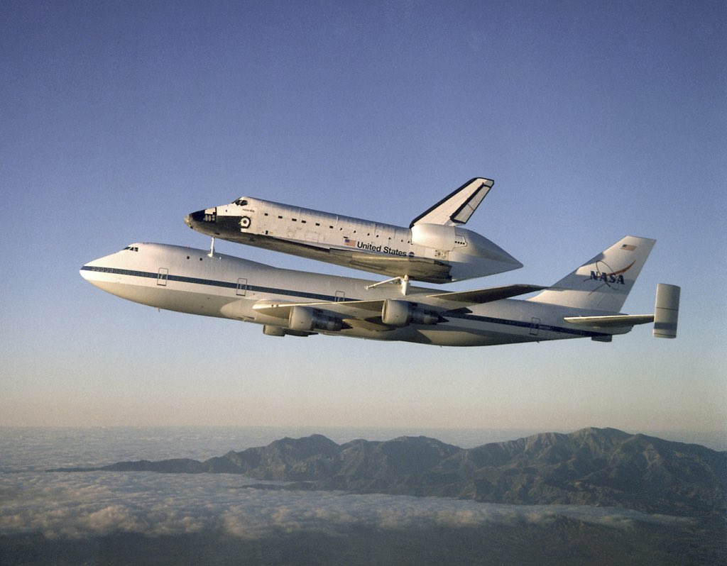 stem_feed's tweet photo. The Space Shuttle Atlantis atop the Shuttle Carrier Aircraft (SCA) returns to the Kennedy Space Center after a ten month refurbishment. (September 1998). https://t.co/4gbgMJUyTV