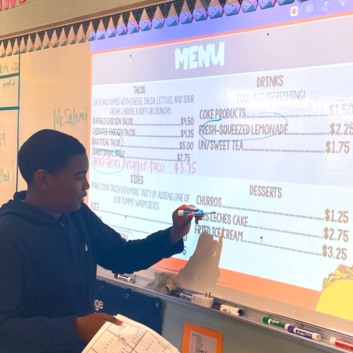 TweetDCS_HLMS's tweet photo. Solving problems involving percent in our math classes today as we complete our Taco Truck project! Ss are taking orders and calculating totals from our admin and teachers. #FlyHigher #TeamDCS https://t.co/bsLs7VETJC