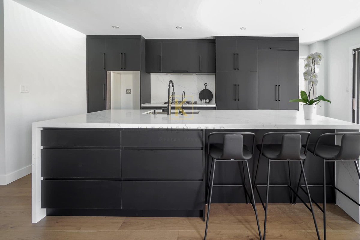 Custom made flat panel contemporary kitchen with hidden pantry, quartz counter top, backsplash and waterfall on the island! #homereno #homerenovation #quartzcountertops #homesweethome #home #custommade #custom #homedecor #homemade #kitchen #customkitchen #kitchendesign #quartz