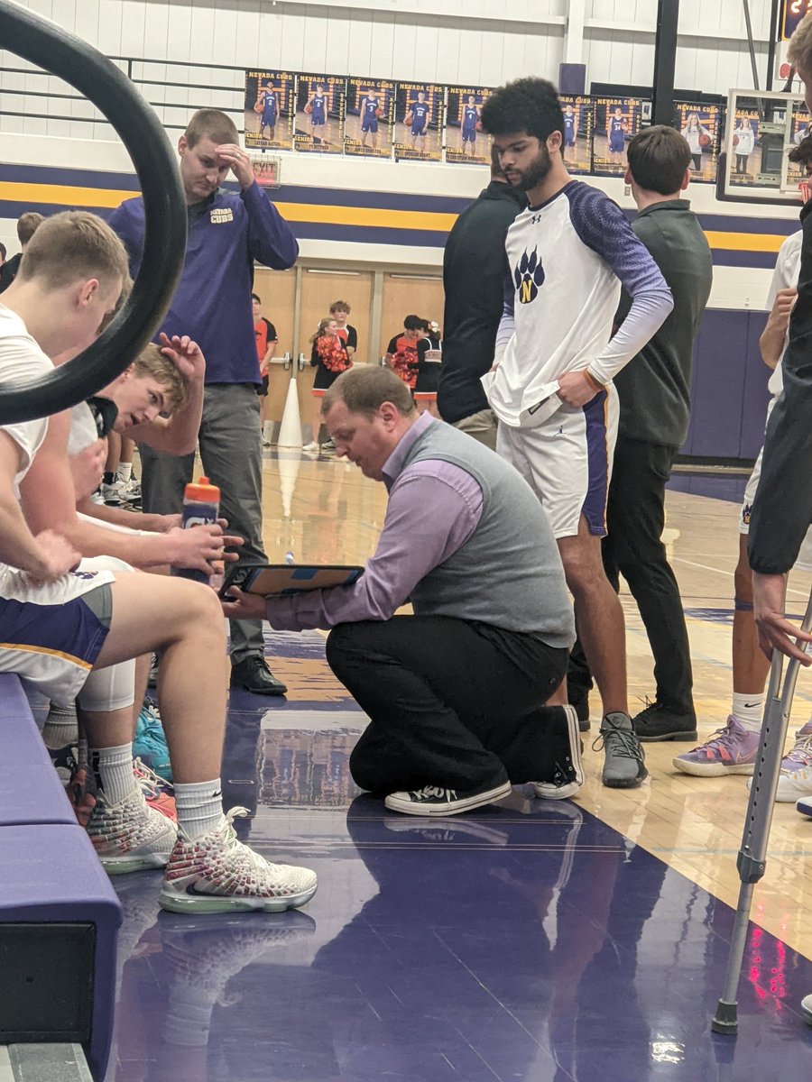 kwake711's tweet photo. Took advantage of tomorrow's late start and kept Zoey up late to sneak in some Cub Basketball! 🏀 Captured Coach Struck with his team with just a few minutes to go in the game. Cubs fought hard for their W tonight! Now sleep in tomorrow, you earned it! #NevadaCubPride https://t.co/bgJ1KjdNhn