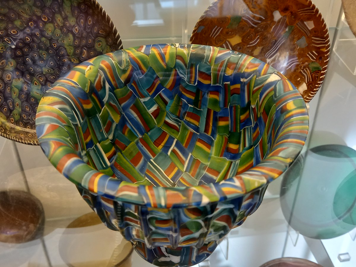 DrJEBall's tweet image. A colourful #Roman glass bowl, probably made in Italy 25BC-AD50. For a while it was thought to be a C19th fake, but scientific analysis suggests it is almost certainly from antiquity - made by/for someone who liked colour! On display at the V&amp;amp;A (London) #RomanArchaeology