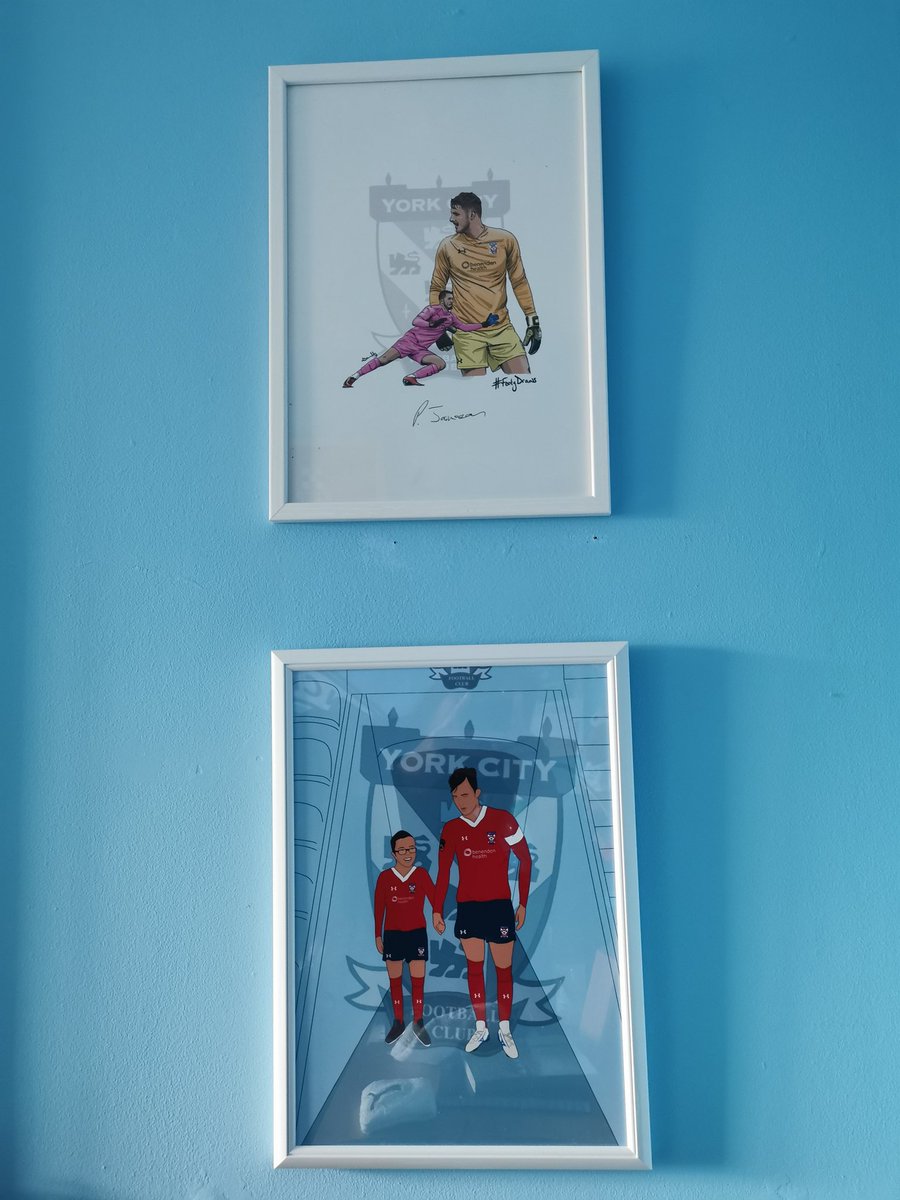 Jack's @ShirtFooty drawing of @PeteJameson1 is finally up on his wall, and looks great alongside his one that @joetait1 gave him. Just need to get his signed shirts framed now!!!!
