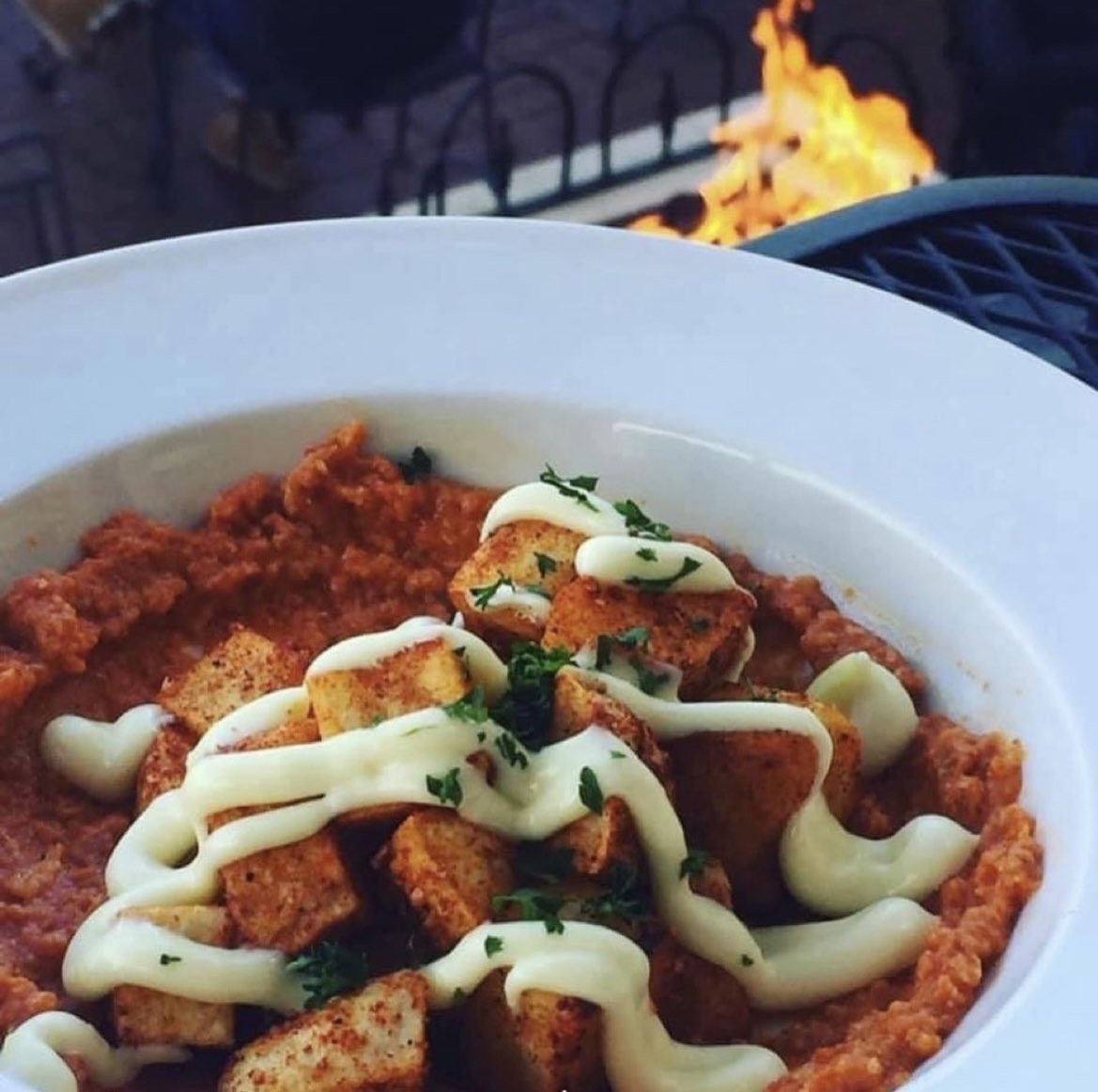 Tapas time @bellavinowinebarstl  patatas bravas topped with Romesco sauce and aioli is Fire 🔥 #tapas #patatasbravas #winebar #foodie #tapaswithatwist #patio #firepit #datenight #stcharleseats