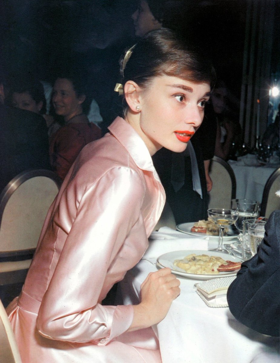SoAudreyHepburn's tweet photo. Audrey Hepburn photographed during a gala in honor of the Duke and the Duchess of Windsor at the Lido Nightclub, Paris, 1955 https://t.co/wA5COh1Hme