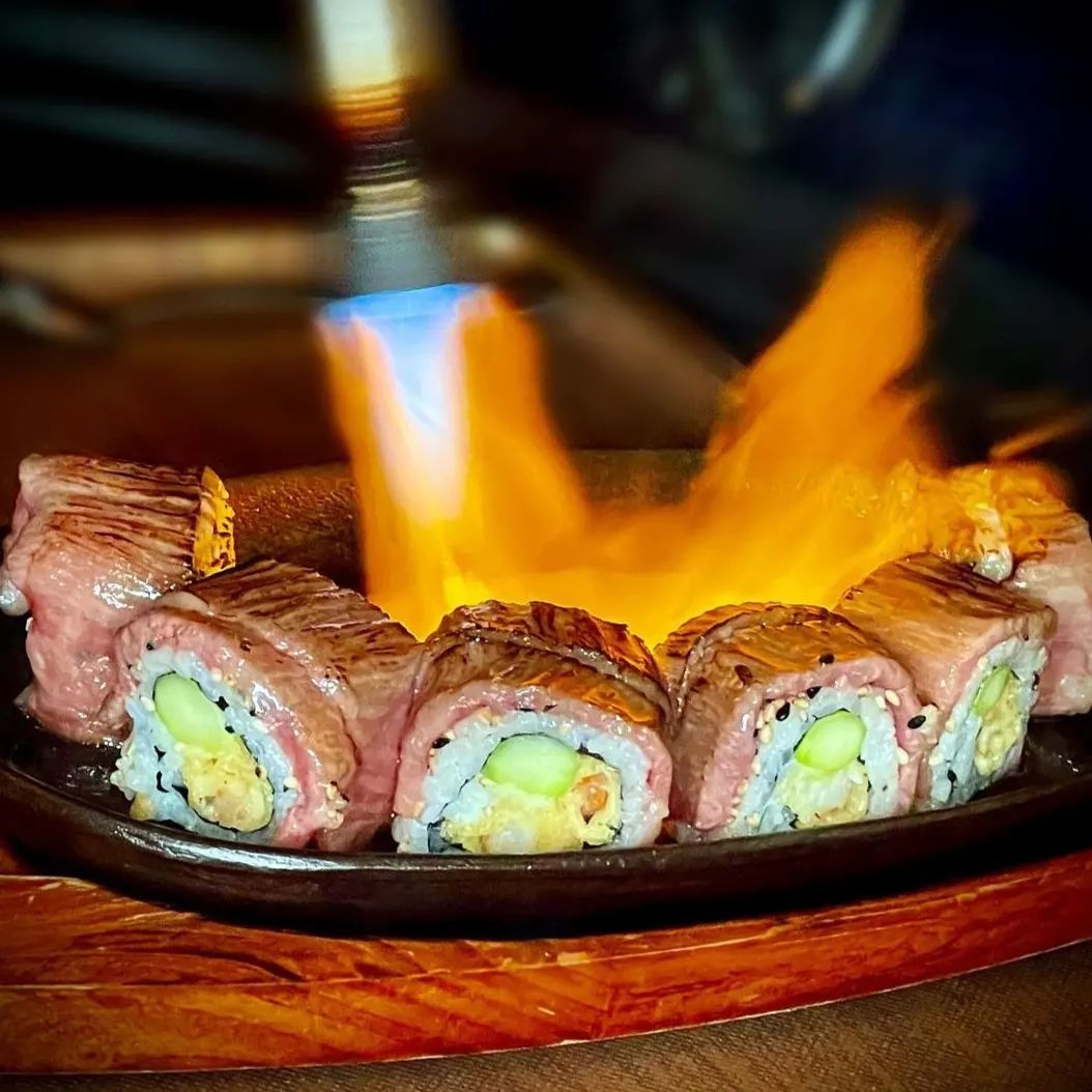 Our Surf &amp; Turf Roll combines two favorites into one delicious bite! Inside you will find the surf with crispy shrimp tempura. Outside is the turf with some tender A5 Wagyu, seared to perfection at your table. A perfect combination!