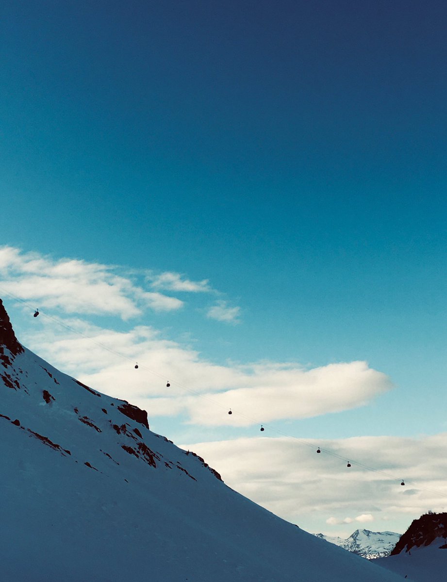 Gondolas on their way to the summit at Mammoth Mountain.