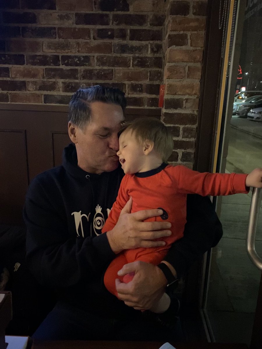 Our adorable Archie snuggling with grandpa.  Mavericks little brother. Melt my heart!!!