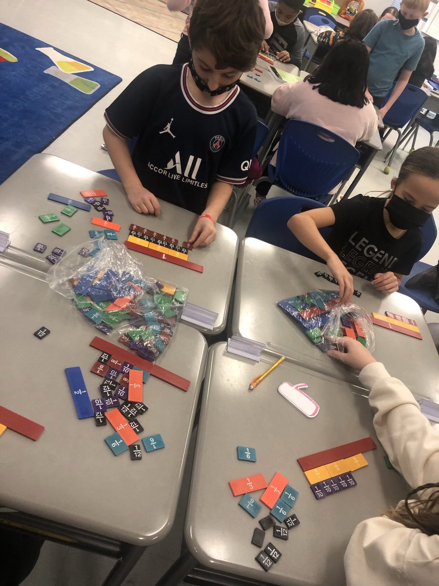 MsEsClassroom's tweet photo. My kiddos were using some fraction manipulatives to learn about equivalent fractions. Seeing them figure out on their own what is equal to each fraction is so fulfilling 💜@PortersNeck @eureka_math #fourthgrade https://t.co/H56N9NtYdp