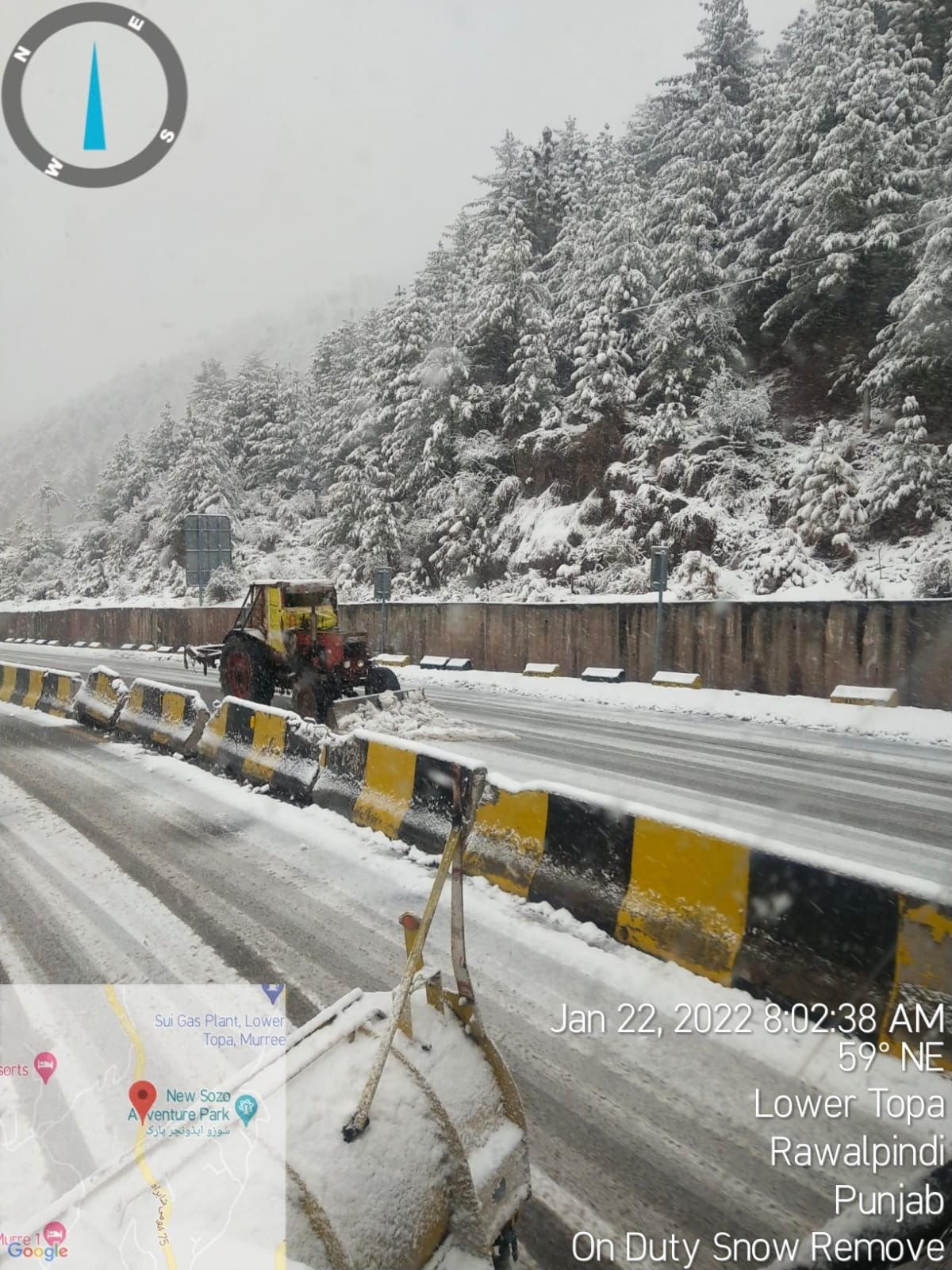 heavy machinery is busy clearing the snow blockage from the main Murree road.