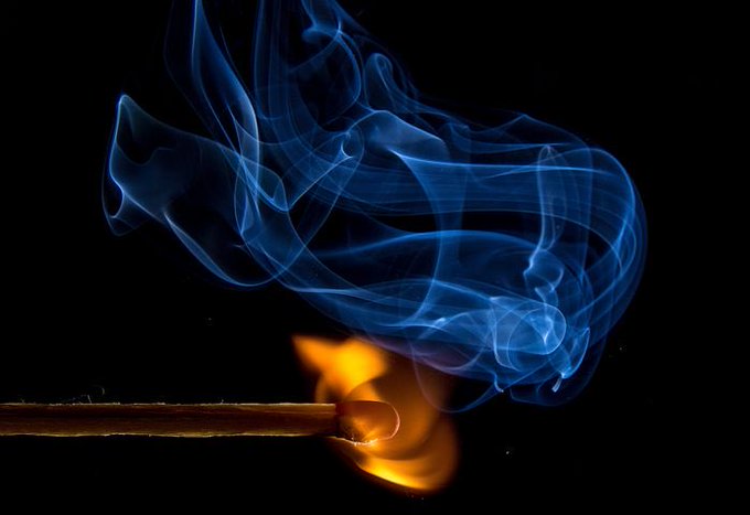 Photo of a burning match