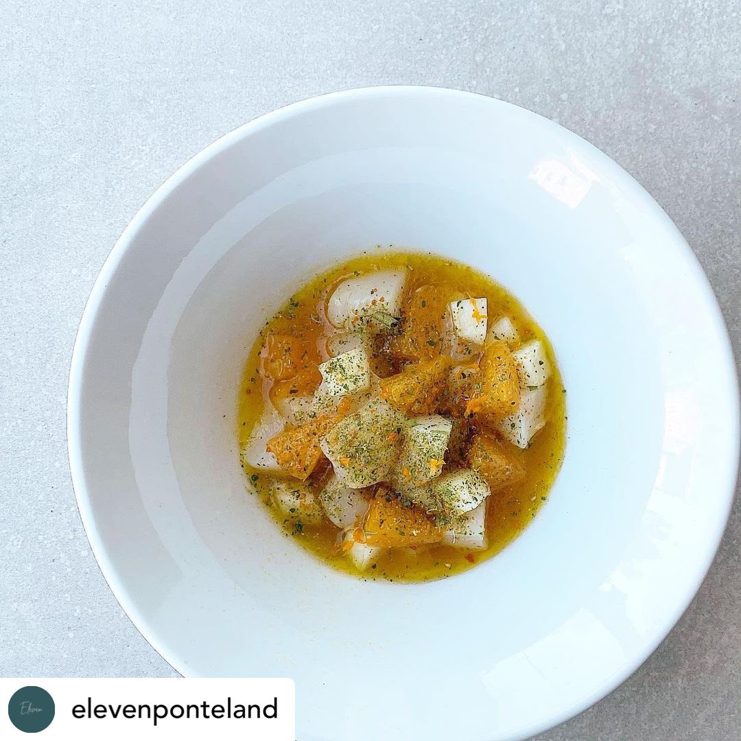 Thanks to @elevenponteland  for this picture, looks delicious. 
Raw scallop dressed with a mandarin and dashi vinaigrette. Tokyo turnip and a seasoning made from mandarin leaf, scallop roe and fennel pollen