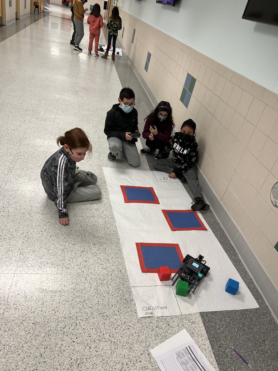 5th graders enjoying robotics with Ms. Hickey