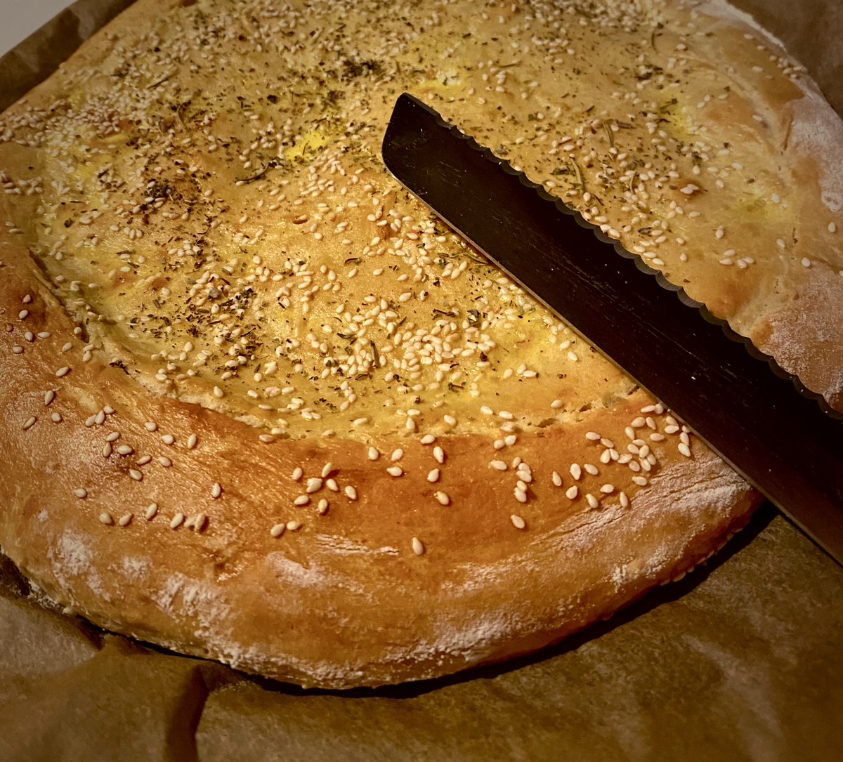 My first attempt at bread-baking.  As you can see, it was merely a stage for my beloved SESAME SEEDS.  YUM!
