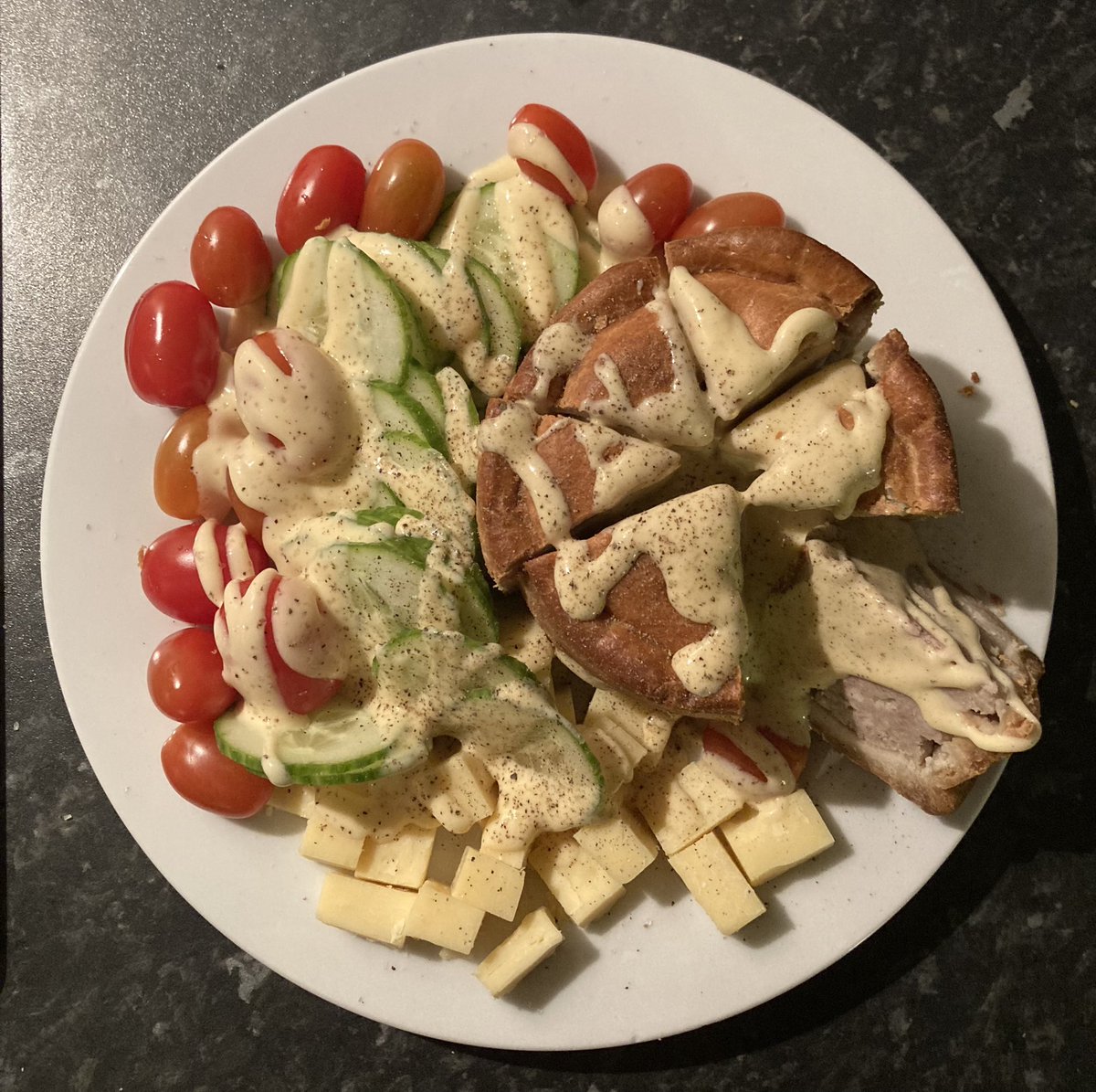 #MeltonMowbray Pork pie (from a pig and a pie), plum tomatoes (not from a plumber), hand reared cucumber, cheese (from cheese) and a sauce from the cream of salad dusted with hand ground black pepper (not from white pepper) #Mmmm