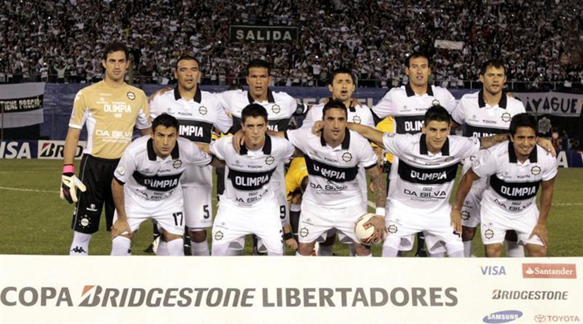LaEterna10's tweet photo. En 2013, Olimpia estaba totalmente sumido en una crisis institucional, pero aún así un grupo unido y dirigido por Ever Hugo Almeida llegó a la final de la Libertadores. Hoy vamos a repasar esta icónica campaña.

[ABRO HILO] https://t.co/jpVSQVyf04