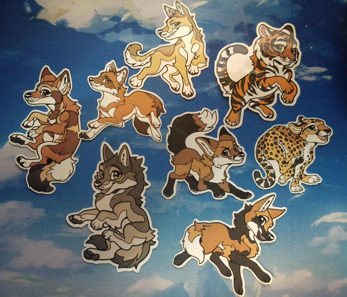auraus's tweet photo. Hoping to find folks who have a particular sticker from @FursonaPins  Canines vs Felines Kickstarter. 
These are the stickers I have that I'm willing to trade for a couple of Black Backed Jackal stickers. 1/2
#cvf #fursonapins #stickertrade https://t.co/jTCLX8kDdU