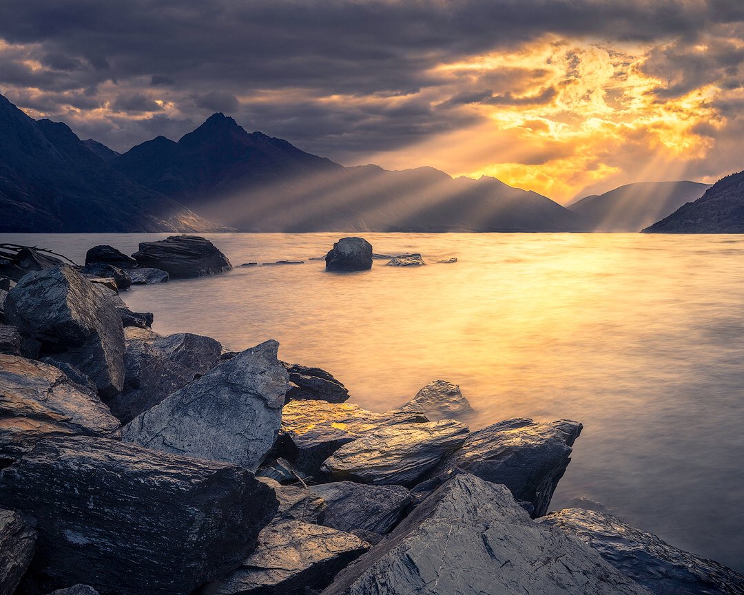 Golden Sunbeams - The day's last sunbeams fan out over Lake Wakatipu.