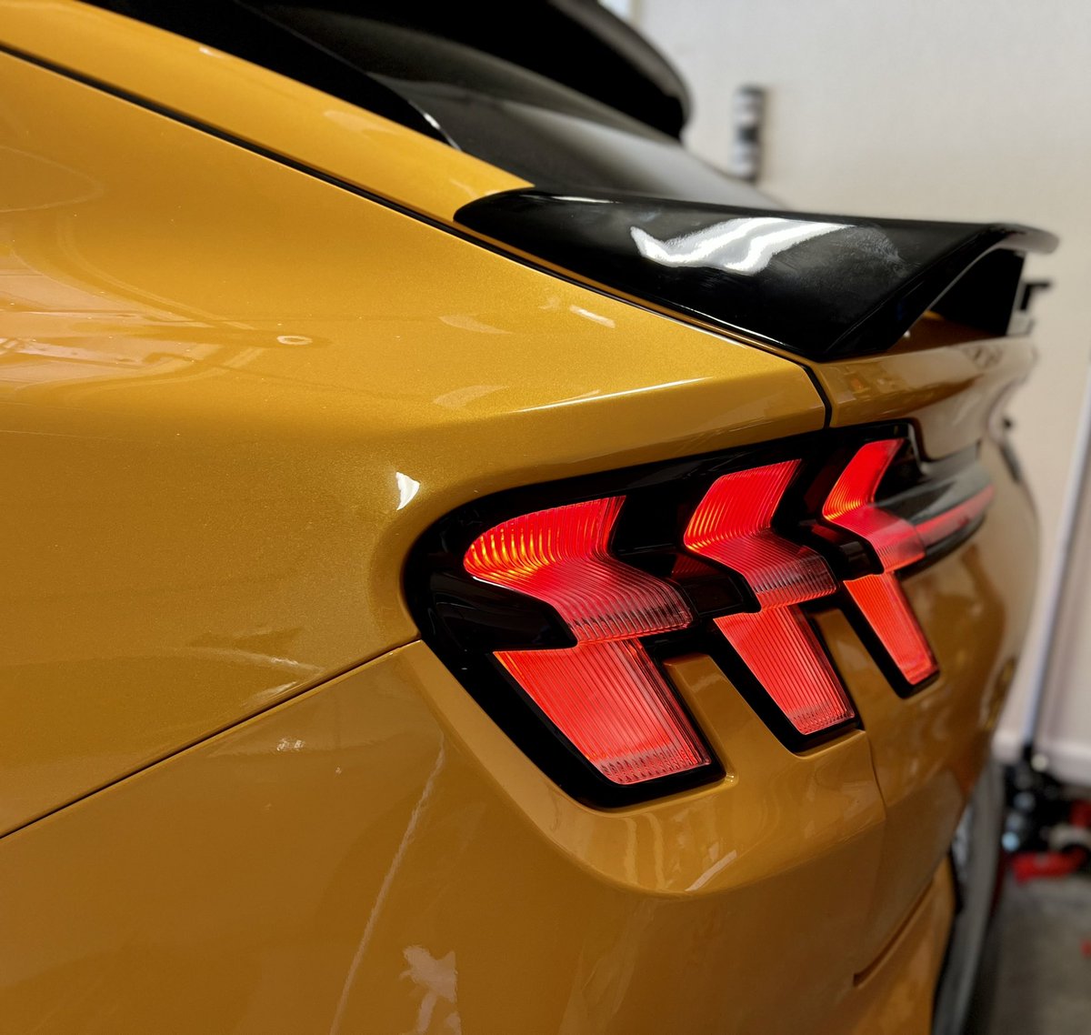 LyftGyft's tweet photo. It’s the little things! Thanks @winespectator73 for hooking me up with this Spoiler.  It added a nice touch to the GT. #MustangMachE #mustang #Ford #ElectricVehicles #performance https://t.co/rYWR5fxZVm