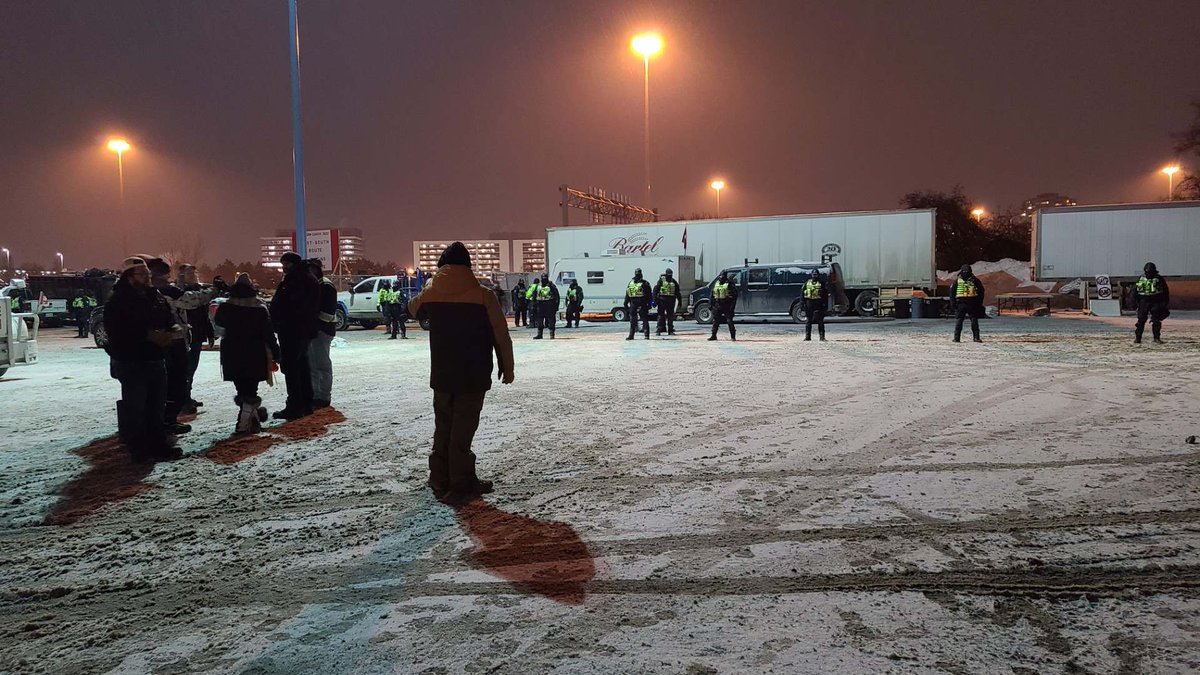 DukeMarcude's tweet photo. This is not our Canada. 
Tactical units surrounding the trucker's camp tonight in Ottawa. https://t.co/BLDKzIEups