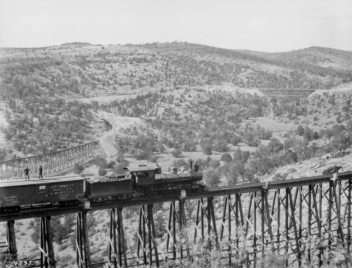 zeitpunkte's tweet photo. Men on a train
A freight train sitting on a high trestle with two men standing on the roof of one of the cars.
1908
Source:  @TheHuntington 

#vintage #history #1900s #train #bridge https://t.co/YhpnPDaOxc