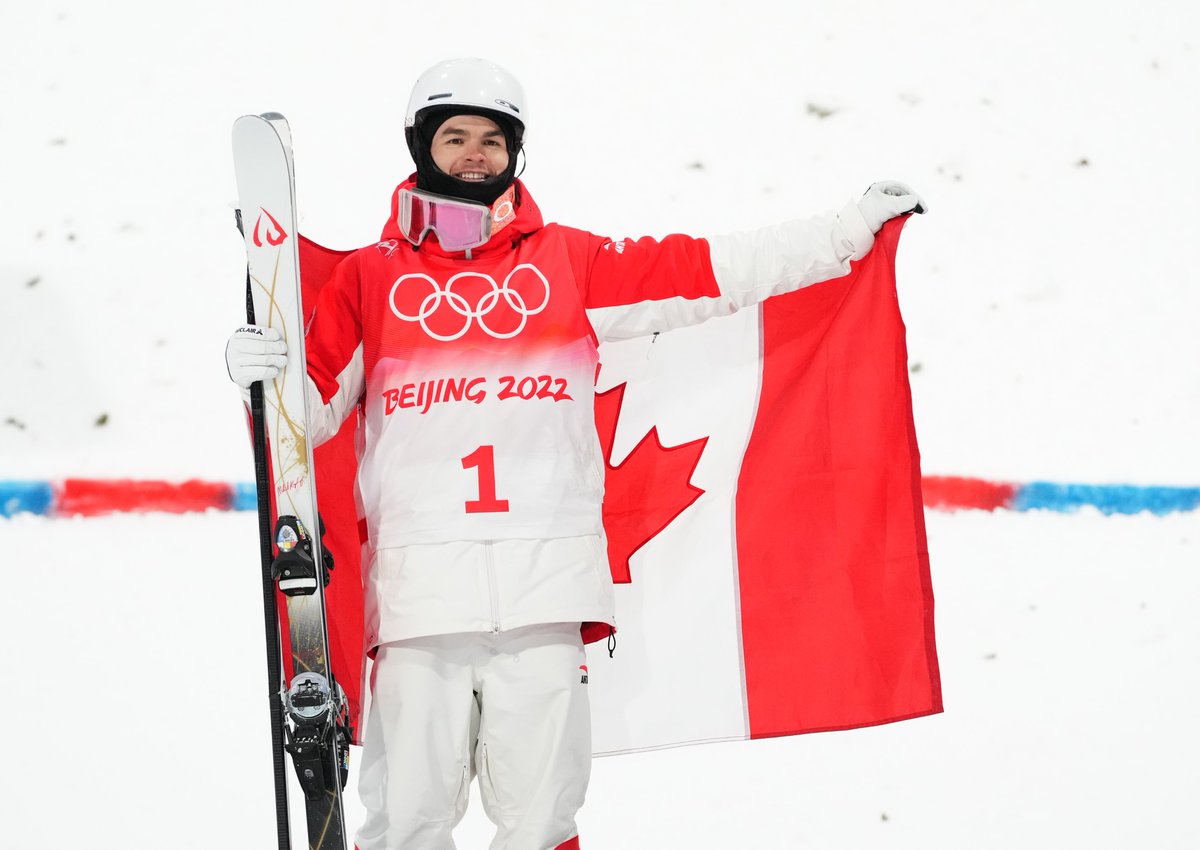 TeamCanada's tweet photo. A historic day for @MikaelKingsbury at #Beijing2022 ✨

After winning his third consecutive Olympic medal, he becomes the first male freestyle skier to win three Olympic medals in any discipline 🥈🥇🥈 https://t.co/Ag9B6qTate