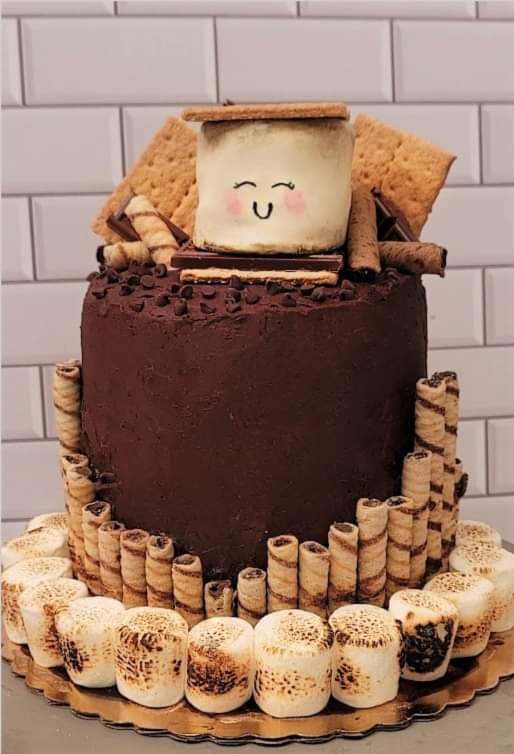 This was a series of accidents that resulted in one of my favorite cakes yet. The edible large smores on top is so cute!