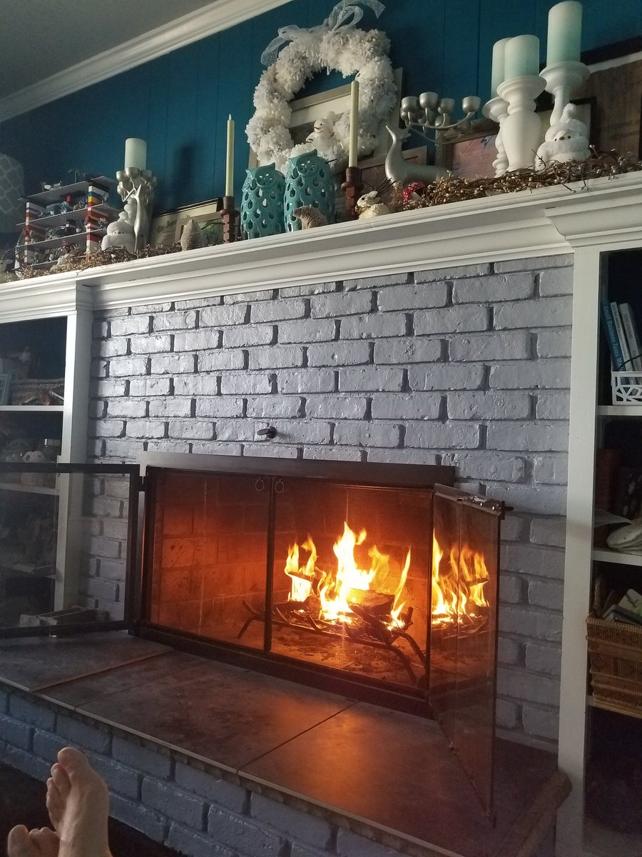 This is why I wanted the room with the fireplace in it. Warming my toes by the fire while I work & it's bitter cold outside. https://t.co/RdBAqjsvzi