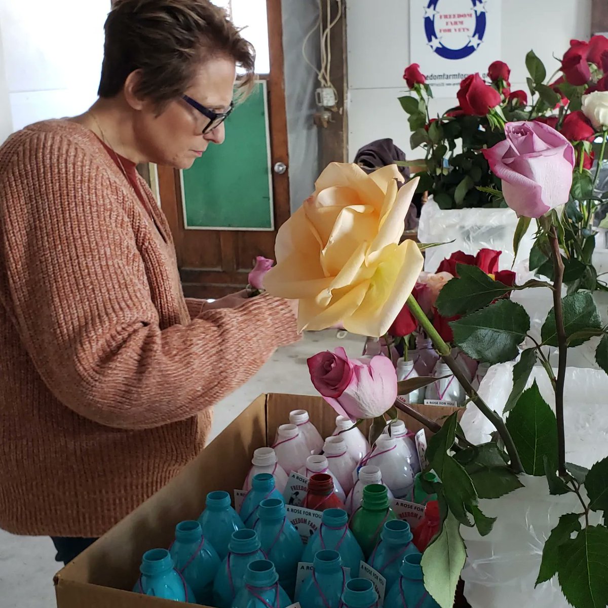 FreedomFarm2011's tweet image. Our Rose Lady getting roses ready for drop off tomorrow for local Veterans at a nursing home. #veterans