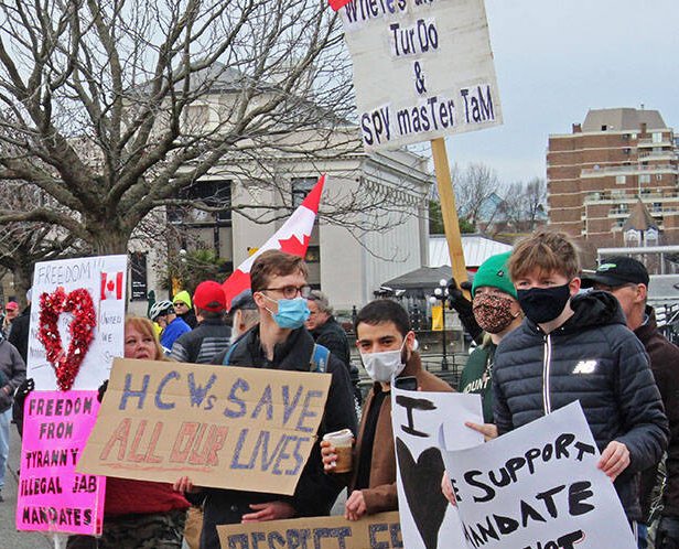 Just about missed the top-most sign ("Spy master Tam") in this VicNews pic from today's Victoria "freedom" convoy. So nice to see the Ottawa occupation doesn't have a monopoly on racists.  #TruckersForFreedom2022