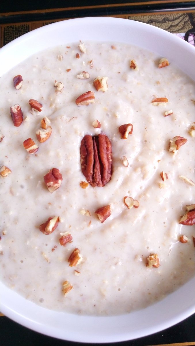porridgelady's tweet photo. Medium #oatmeal to start my #SundayMorning. The #oats have been cooked the traditional way in water and a pinch of sea salt, with a #Spurtle. Then the #Porridge simply topped with pecans. #PorridgeSeason #Porridgerecipe #Winterfood #WinterCare https://t.co/v6u8vtYgUn