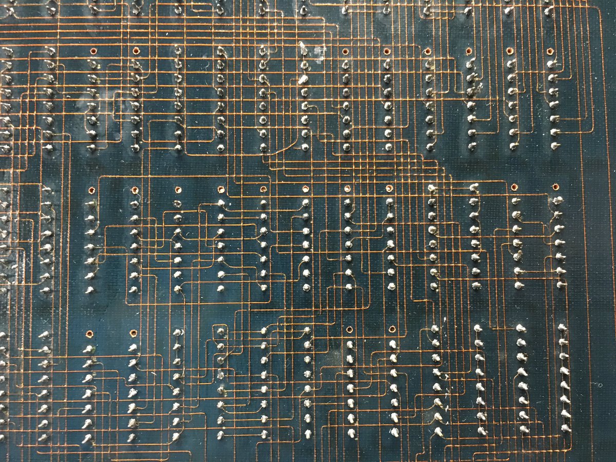 crtdude's tweet image. Here&apos;s something neat. Look closely at this circuit board... 

This board has been made with the multiwire process. The &quot;traces&quot; are enameled wire that has been routed and laid down in a resin and bonded together, rather than being etched. This lets them cross each other.