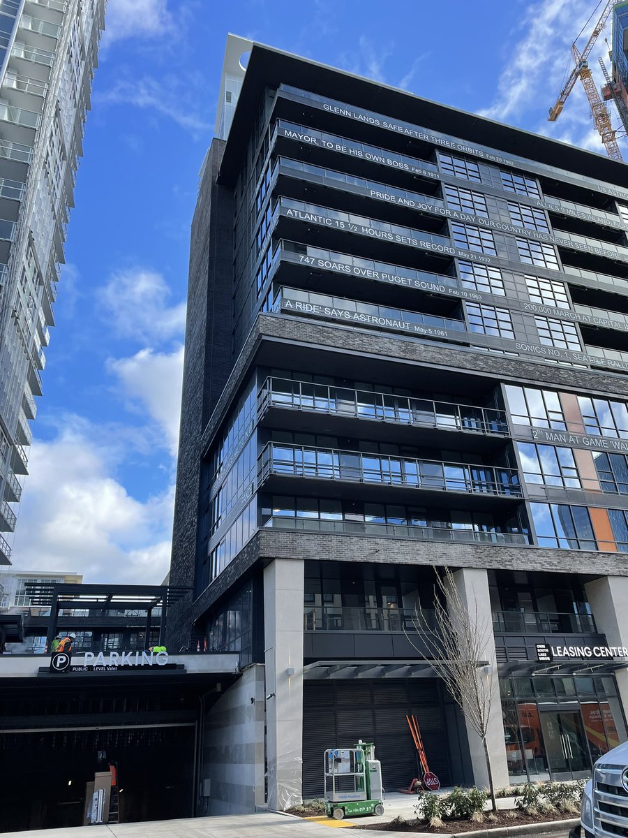 pgcornwell's tweet photo. The massive apartment buildings (rent: $2500+) going up in the former Seattle Times parking lot (RIP) have Times headlines on each floor. If they use any of my stories’ headlines do you think they’ll give me free access to the pools/dog run/climbing wall/karaoke room? https://t.co/jXfRNfTI3V