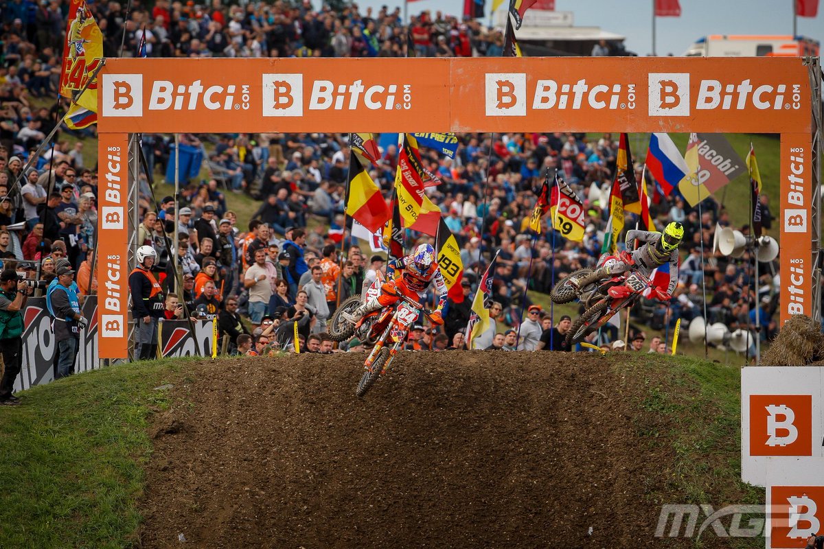 mxgp's tweet photo. Let's play a game of "Spot the riders between all the flags" 😆... This part of the track in Germany always produces the coolest photos thanks to all the fan support 🇩🇪 💪

#MXGP #Motocross |  @bitcicom https://t.co/5C3jgqxMMc