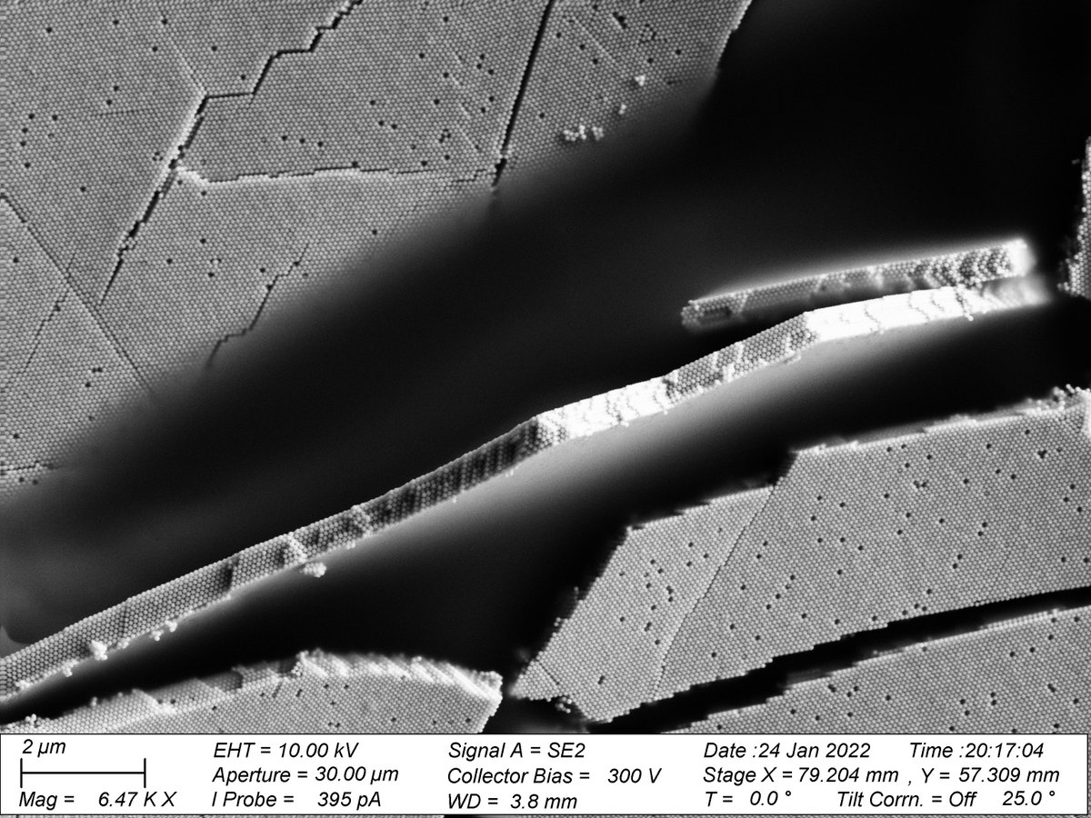 I got lucky: not only a supercrystal (a crystal out of gold nanoparticles) broke, but also a fragment tilted (seems slightly bent as well) so I could obtain this beautiful view with different perspectives on the crystal lattice