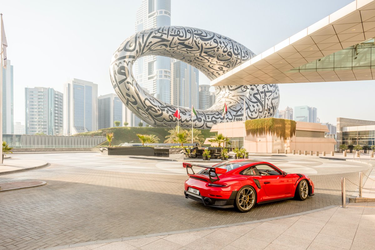 Going for a spin with Karim Al Azhari <a href="/karimporsche/">Karim Al Azhari</a> through Dubai is an extraordinary experience. His #Porsche 911 GT2 RS cuts a good figure in front of the Museum of the Future <a href="/MOTF/">Museum of the Future</a>. More: porsche.click/3gf6zMV