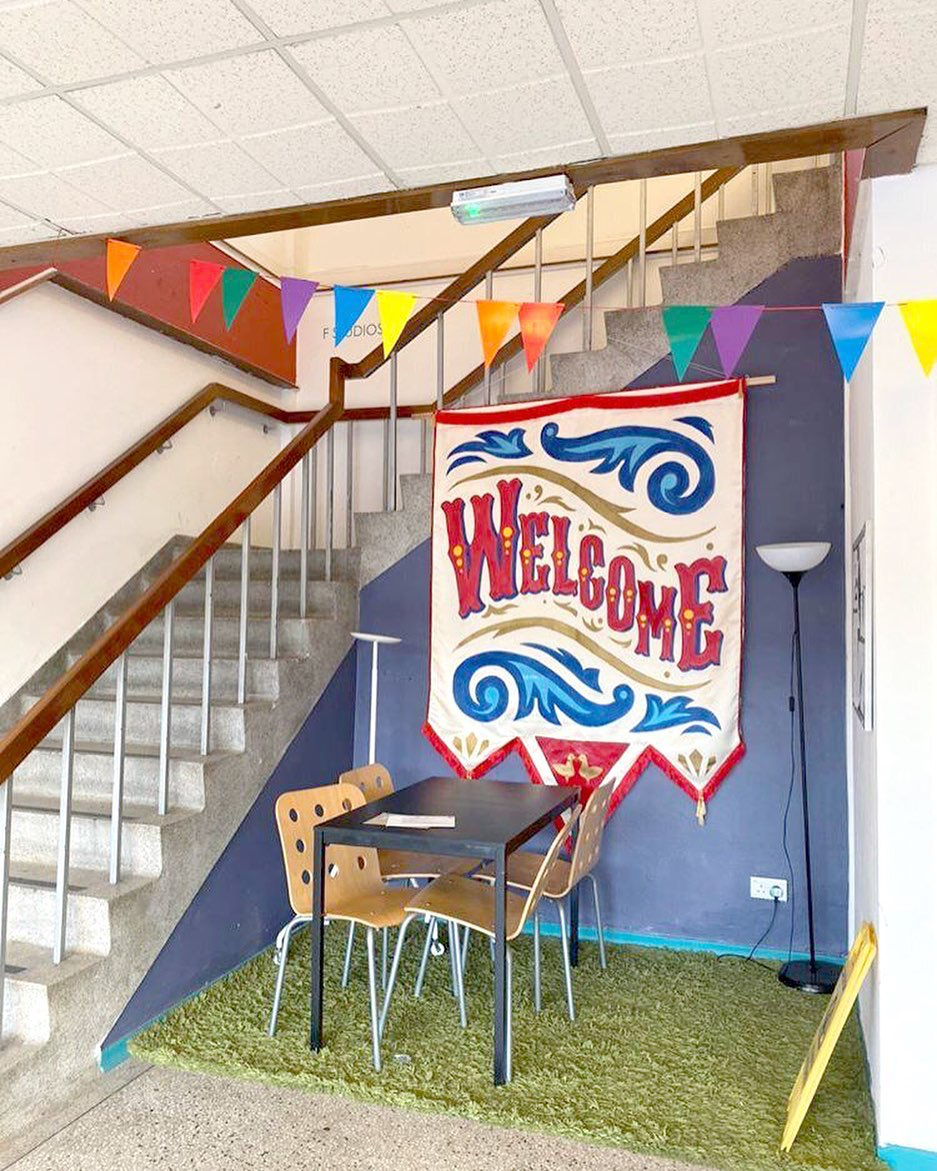 HelloMeanwhile's tweet image. Throwback to 2 years ago when @alice_artwork  made this amazing banner for our building over in Cardiff, Meanwhile House. So colourful!