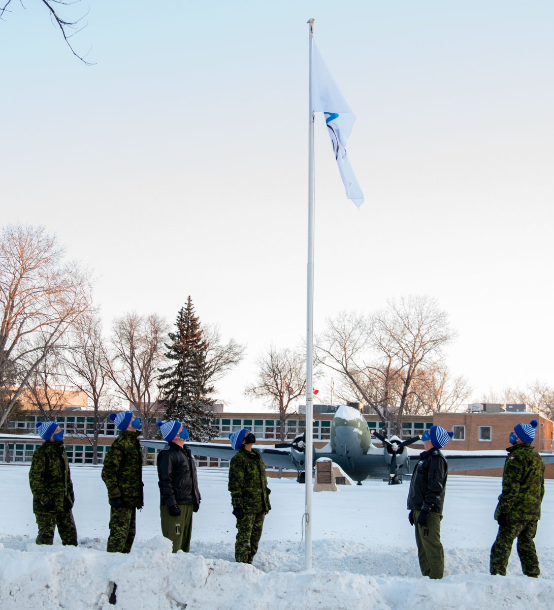 RCAF_ARC's tweet photo. #RCAF command teams from CFB Winnipeg gathered on the parade square to raise the #BellLetsTalk flag, encouraging open dialogue about the importance of mental health within the #CAF. https://t.co/WRPVC079Hf